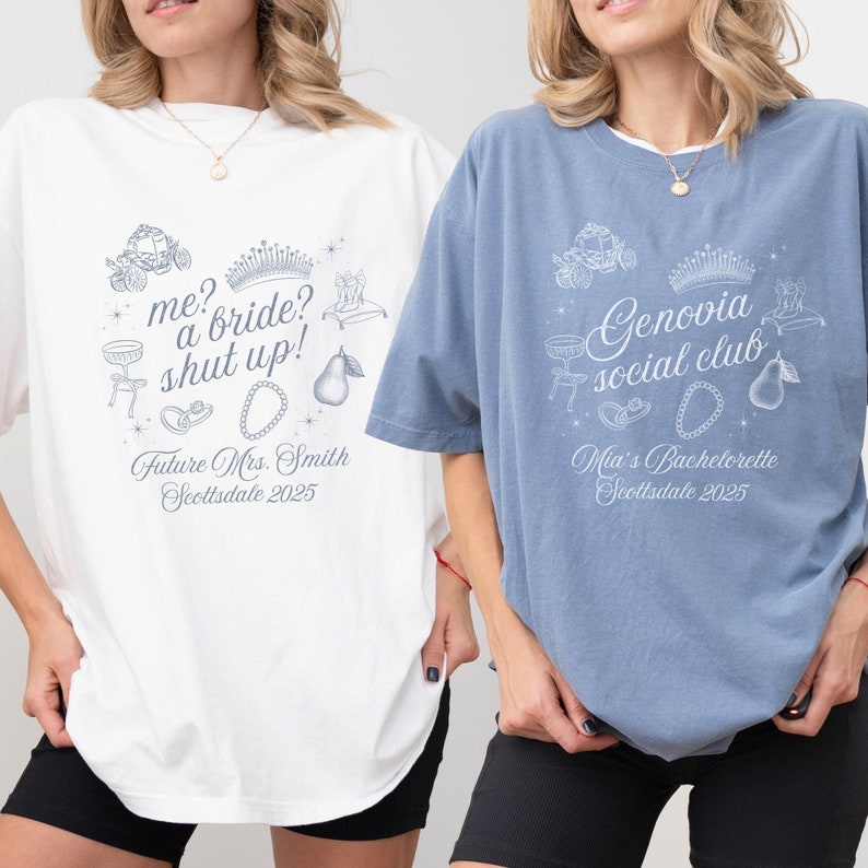 May include: Two oversized t-shirts, one white and one blue, with matching graphic designs. The white shirt reads "me? a bride? shut up!" and "Future Mrs. Smith Scottsdale 2025." The blue shirt says "Genovia social club" and "Mia's Bachelorette Scottsdale 2025."