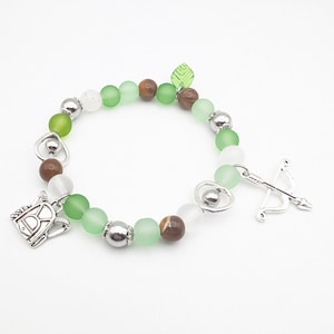 Pulsera inspirada en The Last of Us, edición premium de Ellie TLOU, hecha a mano, elástica, con cuentas de vidrio y dijes de metal.