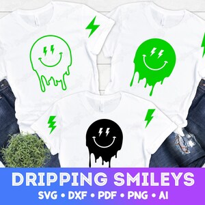 May include: White t-shirts with a dripping smiley face design in green and black. Each shirt has a green lightning bolt on the sleeve. The text "DRIPPING SMILEYS" is displayed at the bottom of the image.