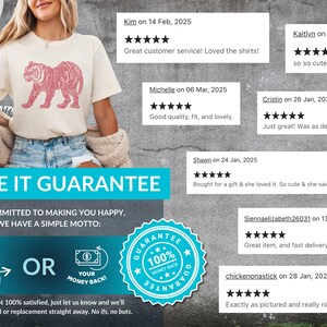 May include: A white t-shirt featuring a pink tiger graphic print. The shirt has a crew neck and short sleeves. The image also includes text that says "LOVE IT GUARANTEE" and "WE'RE COMMITTED TO MAKING YOU HAPPY, SO WE HAVE A SIMPLE MOTTO: LOVE IT! OR YOUR MONEY BACK!"  The image also includes a blue circle with a white star and the text "GUARANTEE 100% MONEY BACK".