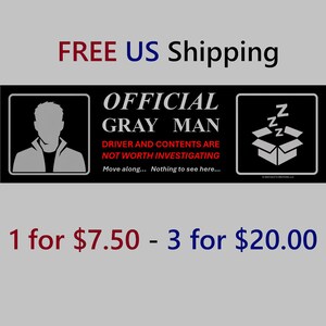 May include: A rectangular black sticker featuring a gray silhouette of a person on the left and a box with ZZZ symbols on the right. The text reads: OFFICIAL GRAY MAN, DRIVER AND CONTENTS ARE NOT WORTH INVESTIGATING, Move along... Nothing to see here...
