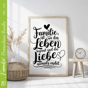 May include: Black and white typography print with the text "Familie, ist wo das Leben beginnt und die Liebe niemals endet". The print is framed in a light wood frame and is hanging on a white wall.