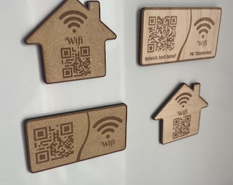 May include: Four wooden magnets with a wifi symbol and a QR code. The magnets are shaped like a house and a rectangle. The text on the magnets reads "Wifi" and "Network: hood home?"