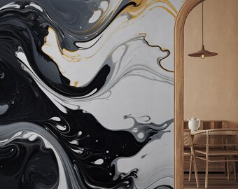 May include: Abstract wall art featuring swirling black, grey, and gold paint. The art is displayed on a wall in a room with wooden floors and a doorway leading to another room.