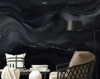 May include: A black and gold abstract swirl pattern wallpaper with a black wicker chair, a white round side table, and a white throw blanket on a bench.