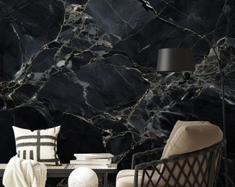 May include: A black and white marble patterned wallpaper with a black floor lamp, a white throw blanket, a white pillow, a white round decorative object, a black and brown chair, and a stack of books.