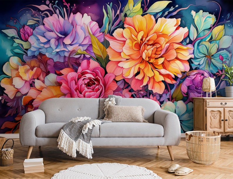 May include: A vibrant floral wall mural featuring large, colorful blooms in shades of pink, orange, blue, and purple. The flowers are painted in a watercolor style, creating a soft and artistic look. A gray sofa with wooden legs sits in front of the mural.