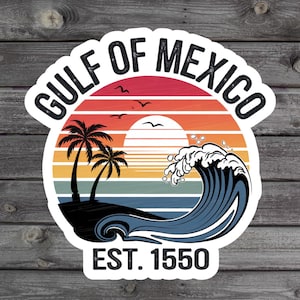 May include: A retro-style sticker with a sunset and ocean wave design. The sticker says "Gulf of Mexico Est. 1550" in white text on a white background.