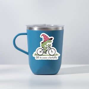 May include: A set of three ceramic mugs with a speckled, matte finish. The mugs are in shades of cream, light gray, and dark gray. Each mug has a simple, modern design and a rounded handle.