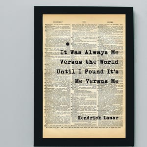 May include: A vintage dictionary page with a quote from Kendrick Lamar: "It Was Always Me Versus the World Until I Found It's Me Versus Me".