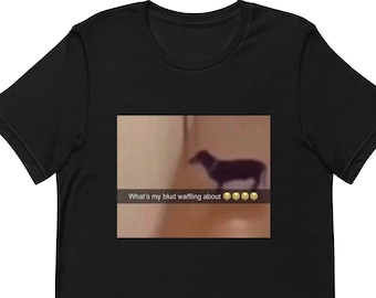 May include: Black t-shirt with a blurry image of a dog and the text "What's my blud waffling about" with a row of yellow smiley faces.