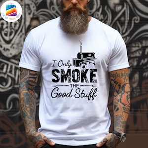 May include: White t-shirt with a black graphic of a smoker and the text "I Only Smoke The Good Stuff".