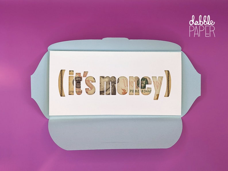 May include: A light blue card with a white interior. The interior has a cut-out design of the words "(it's money)" with dollar bills visible through the cut-outs.