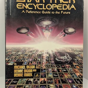 May include: The Star Trek Encyclopedia book cover. The cover features the title in gold lettering, with images of starships and a grid of images. The book is a reference guide to the future.