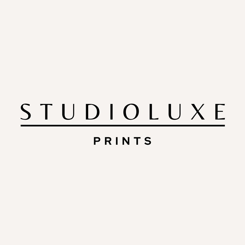 May include: Black and white logo for Studioluxe Prints. The logo features the text "Studioluxe" in a bold, sans-serif font with a thin line underneath. The text "Prints" is below the line in a smaller font.