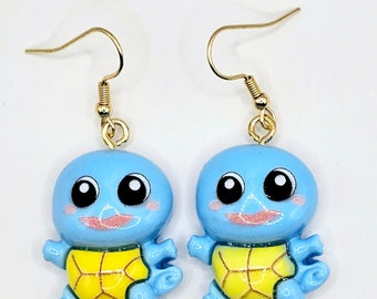 Pendientes kawaii de cartas coleccionables