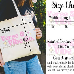 May include: A natural canvas tote bag with the text "Verse & Vibe Co. where fashion meets fiction" in pink and gold lettering. The bag is 15 inches wide, 16 inches long, and has a 20 inch handle. The bag is made of 100% cotton and is machine washable.
