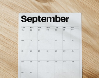 May include: A black and white calendar with the word "September" at the top. The calendar is divided into seven columns for each day of the week, starting with Sunday and ending with Saturday. The numbers 1 through 31 are listed in the boxes, representing the days of the month.