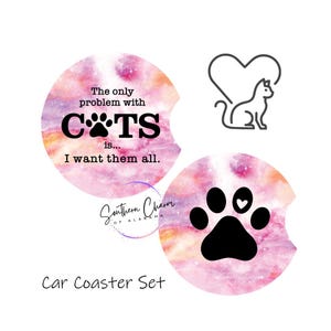 May include: A car coaster set featuring two round coasters with a watercolor-style background in pink, orange, and white. One coaster has the text "The only problem with CATS is... I want them all." The other has a cat paw print.