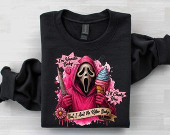 May include: A black long-sleeve sweatshirt featuring a graphic of a masked figure in a pink hooded robe holding a knife and an ice cream cone. The text reads: I'm Vanilla Baby, I'll Choke You, But I Ain't No Killer Baby, with pink hearts and a flower.