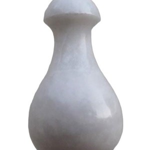 May include: White marble light pull with a pear-shaped design.