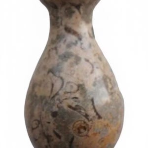 May include: A small, pear-shaped decorative object crafted from polished stone. The surface features a mottled, multi-coloured pattern with shades of beige, grey, brown, and dark flecks, showcasing natural fossilised inclusions throughout the material.