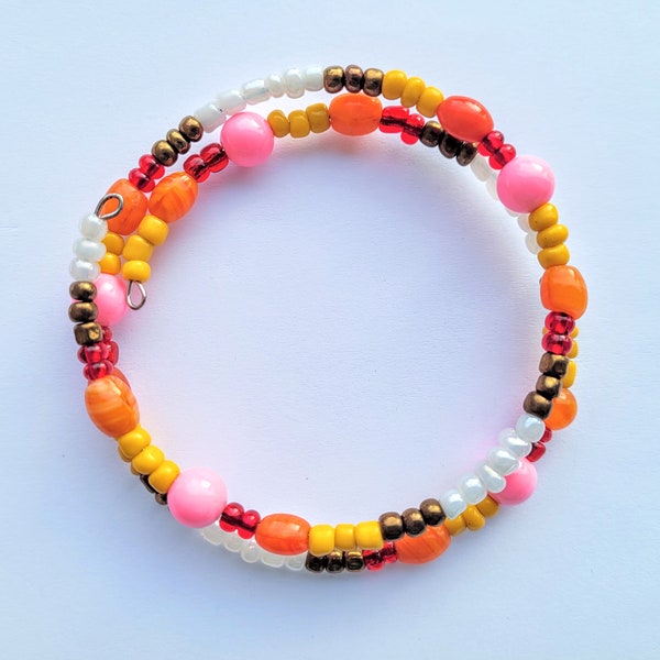 Warm-Toned Memory Wire Handmade Bracelet | Memory Wire One Size Fits All Bracelet | Yellow, orange, bronze, white, pink, and red glass beads