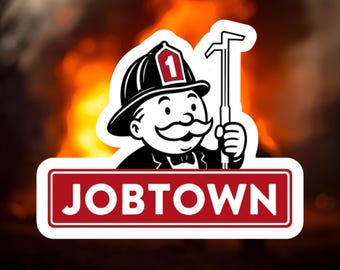 May include: A sticker featuring a cartoon character in a firefighter's helmet with the number 1. The character holds a tool and is set against a backdrop of flames. The word "JOBTOWN" is displayed in a red rectangle.