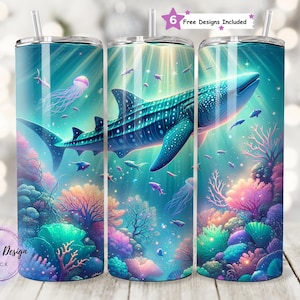 May include: A set of three stainless steel tumblers with a vibrant underwater scene featuring a whale shark, coral, and jellyfish. The design includes the text "Shelby's Design Shack" and "6 Free Designs Included".