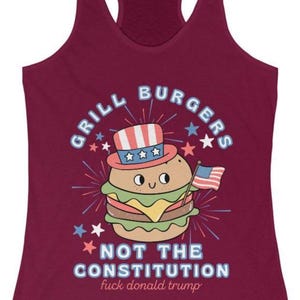 May include: Burgundy vest top featuring a burger illustration wearing an Uncle Sam hat and holding a small American flag. Text reads "GRILL BURGERS" and "NOT THE CONSTITUTION fuck donald trump."