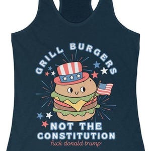 May include: Navy blue vest top featuring a burger illustration wearing a patriotic hat and holding a US flag. Text reads "GRILL BURGERS" and "NOT THE CONSTITUTION fuck donald trump".