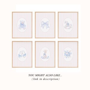 May include: Set of six framed prints with a pink and white striped background. Each print features a different image of a baby animal or object with blue and white floral accents. The images include a teddy bear, a bow, a rocking horse, a pair of slippers, a giraffe, and a bouquet of flowers.