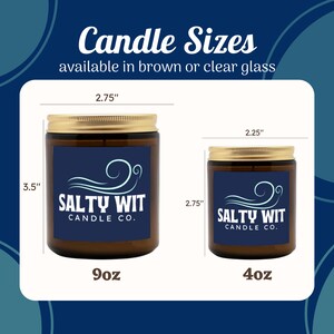 May include: Two sizes of candles in brown glass jars with gold lids. The larger candle is 9oz and measures 3.5 inches tall and 2.75 inches wide. The smaller candle is 4oz and measures 2.25 inches tall and 2.75 inches wide. Both candles have a blue label with the text "SALTY WIT CANDLE CO."