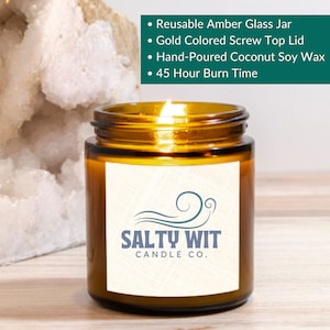 May include: A brown glass candle jar with a gold lid and a white label. The label has a blue wave design and the text "SALTY WIT CANDLE CO.".