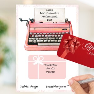 May include: A pink typewriter with a gift card that says "Gift Card" with a red bow on top. The card is on a pink and white card with the text "Happy Administrative Professional Day!" and "Thank You for all you do!"  The card is signed "To: Ms. Angie From: Marjorie".