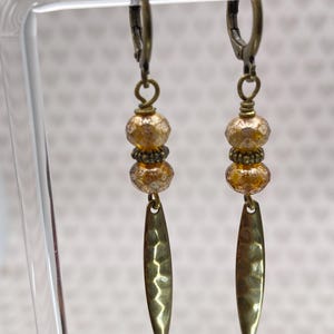 May include: A set of three ceramic mugs with a speckled, matte finish. Each mug features a different color: light blue, cream, and gray. The mugs have a simple, modern design and a comfortable handle. Perfect for coffee or tea.