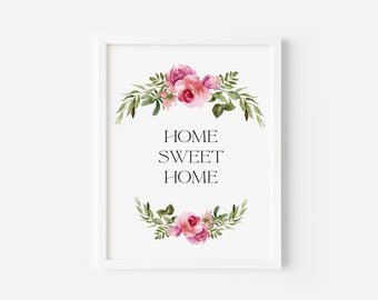 May include: A white framed print with a watercolor floral design featuring pink roses and green leaves. The text "HOME SWEET HOME" is centered on the print.