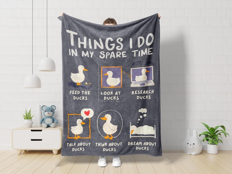 Funny Ducks Blanket featuring playful duck illustrations, designed as a Duck Lover Gift for Him or Her. This Duck fleece blanket works as duck baby blanket, Duck Theme Decor, and duck nursery decor. A Hilarious Duck Gift and Duck Mom Gift perfect for Duck Owner Gift occasions, duck gag gift ideas, and Farmhouse Gift styling for any Duck Enthusiast who loves farm animals.