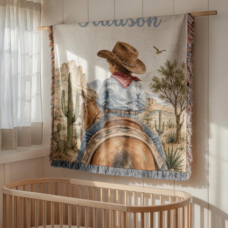 Western baby blanket featuring the full personalized cowboy nursery design with baby name styling, rodeo horse artwork, and Southwest inspired details for baby boys and toddlers. The full design makes this custom baby blanket a standout piece for cowboy baby shower gifts, western baby gifts, first rodeo décor, and blanket for kids displays. A meaningful baby keepsake for families who love horseback riding, rodeo themes, and cowboy baby blankets.