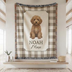 Styled Goldendoodle blanket displayed in a baby boy nursery, enhancing golden doodle décor with cozy woven texture and soft tones. This personalized dog name blanket adds warmth and charm to dog-themed nursery spaces, making it ideal as both décor and comfort piece. A cute dog blanket perfect for modern baby rooms.