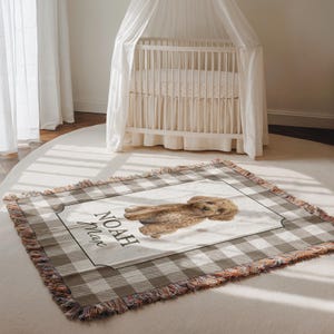 personalized Goldendoodle blanket showcasing detailed puppy design with custom name clearly visible. This woven dog blanket highlights texture and artwork, making it a standout piece for nursery décor or dog themed gifts. Perfect as a custom dog gift, baby keepsake blanket, or Goldendoodle lover gift.