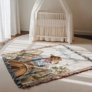 Western cowboy baby blanket with personalized baby name design and rodeo horse theme makes a thoughtful cowboy baby shower gift, unique baby boy gift, or toddler boy gift. This custom baby blanket is ideal for baby boys, little kids, first rodeo birthdays, western nursery décor, and Southwest baby keepsakes. A sweet blanket for families who love horseback riding, rodeo horses, cowboy nursery style, and personalized baby boy blankets.