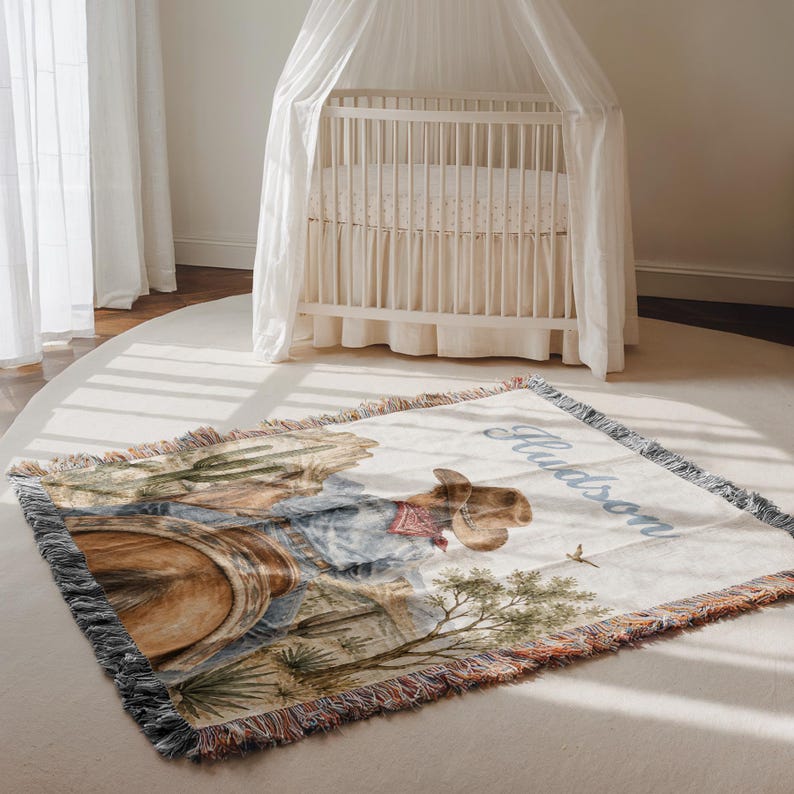 Western cowboy baby blanket with personalized baby name design and rodeo horse theme makes a thoughtful cowboy baby shower gift, unique baby boy gift, or toddler boy gift. This custom baby blanket is ideal for baby boys, little kids, first rodeo birthdays, western nursery décor, and Southwest baby keepsakes. A sweet blanket for families who love horseback riding, rodeo horses, cowboy nursery style, and personalized baby boy blankets.