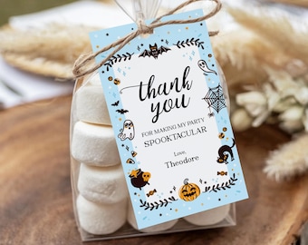 May include: A clear cellophane bag filled with marshmallows, tied with twine, and a light blue tag. The tag reads "thank you" with Halloween-themed illustrations and the text "For making my party Spooktacular."