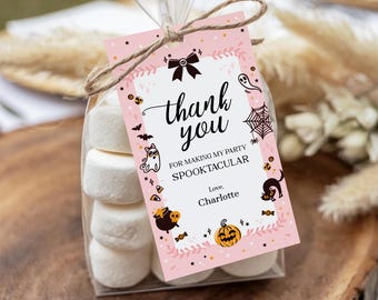 May include: A clear cellophane bag filled with marshmallows, tied with twine, and a pink tag. The tag reads "thank you" with Halloween-themed illustrations and the text "FOR MAKING MY PARTY SPOOKTACULAR".