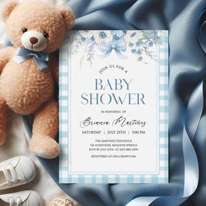 May include: A baby shower invitation with a blue gingham border and floral details. The invitation text reads "Join us for a Baby Shower" and includes event details. A teddy bear and baby shoes are in the background.