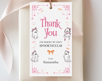 Może przedstawiać: Biała etykieta prezentowa z różową obwódką i ilustracjami w stylu Halloween. Etykieta zawiera napis "Thank You" i "For making my party Spooktacular". Zawiera ilustracje duchów i imię "Samantha".