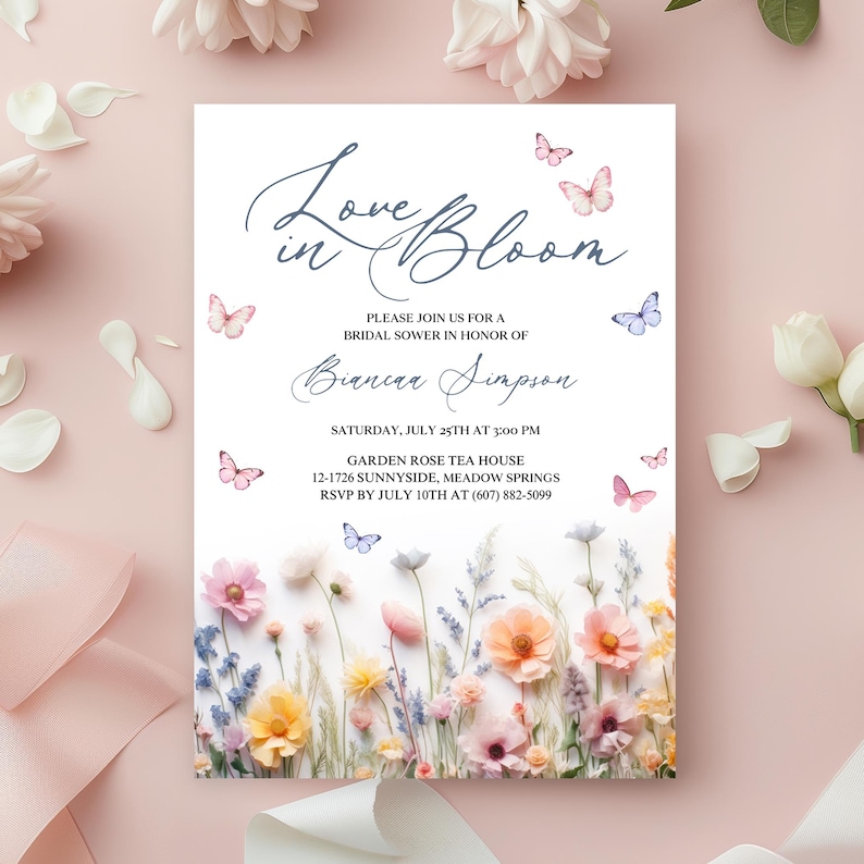 May include: A bridal shower invitation with a floral design featuring pastel pink, yellow, and blue flowers. The invitation reads "Love in Bloom" and includes the bride's name, the date and time of the shower, and the location. Butterflies are scattered throughout the design.