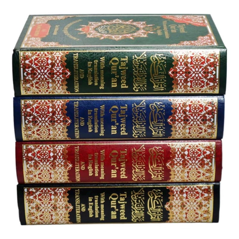 May include: A stack of four green, blue, and red hardcover books with gold accents. Each book has the title "Tajweed Qur'an" with the words "With meaning translation in English and transliteration" printed on the spine.
