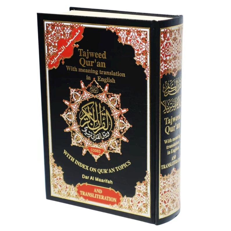 May include: Black hardcover book with gold lettering titled "Tajweed Qur'an" with meaning translation in English. The book has a gold and red decorative border and includes an index on Qur'an topics and transliteration.